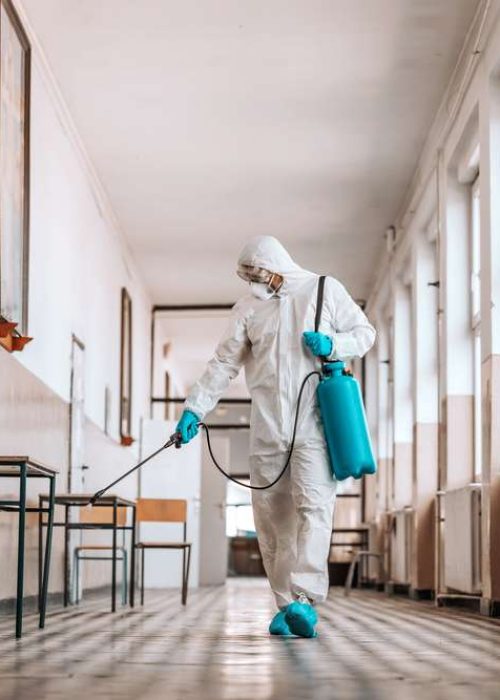 Worker,In,Sterile,White,Uniform,,With,Mask,And,Glasses,Holding