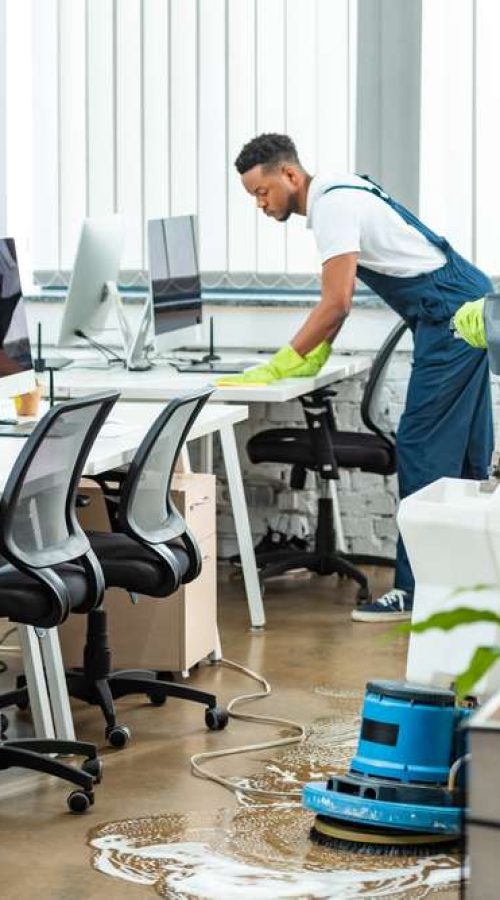 Multicultural,Team,Of,Cleaners,Working,In,Modern,Open,Space,Office