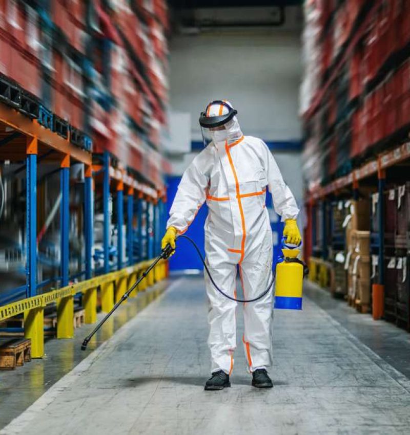 Man,Worker,With,Protective,Mask,And,Suit,Disinfecting,Industrial,Factory
