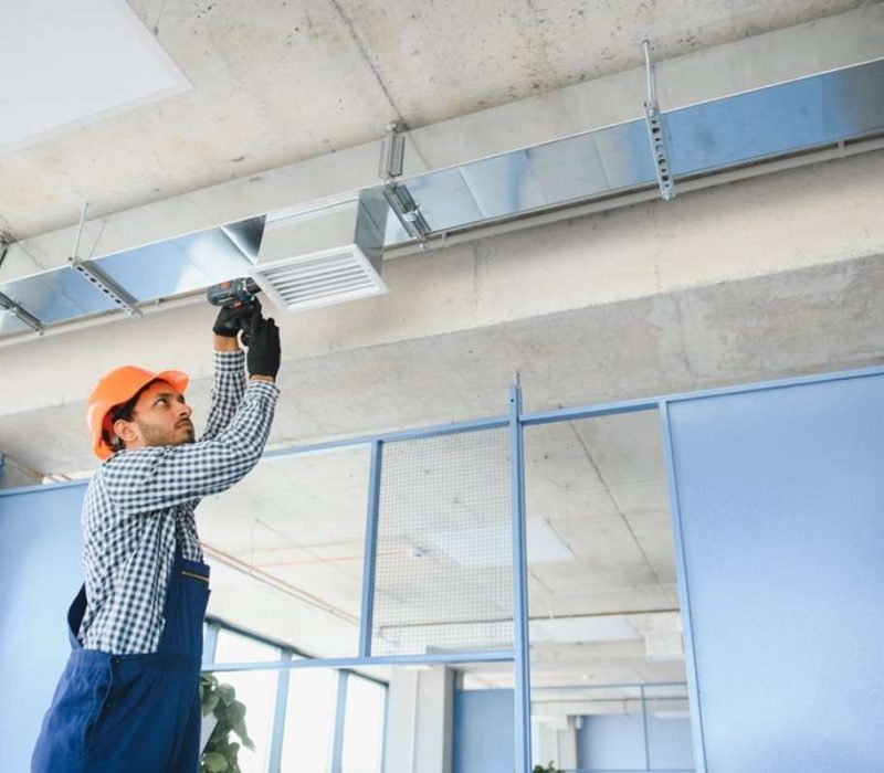 hvac_technician_cleaning_vent