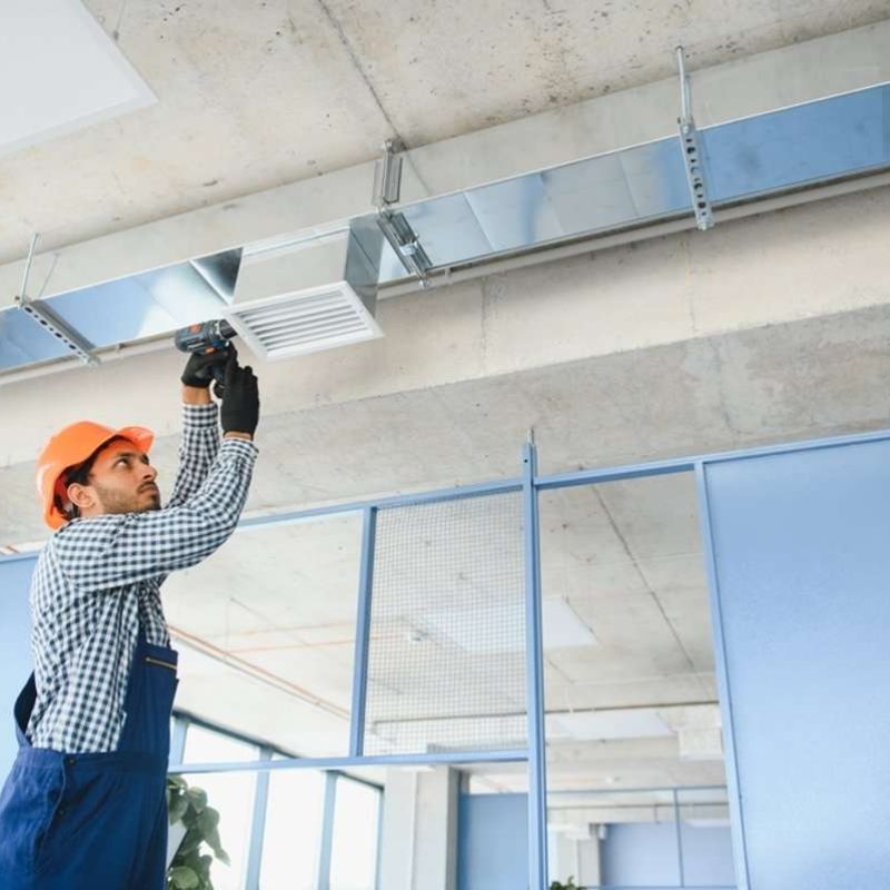 hvac_technician_cleaning_vent