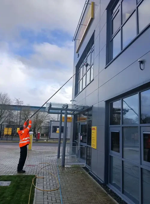 window_cleaning_man_pole_orange_
